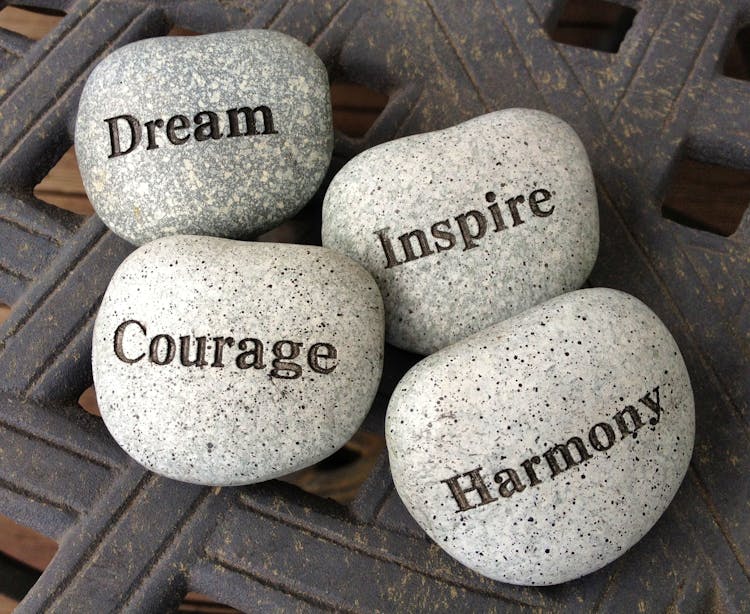 4 stones written: dream, courage, inspire, and harmony 4 stones written: dream, courage, inspire, and harmony