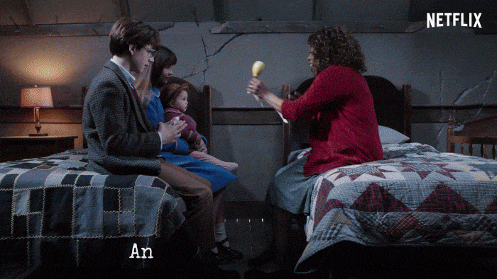 Lady giving a baby a toy Lady giving a baby a toy