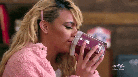 Woman smelling candle Woman smelling candle