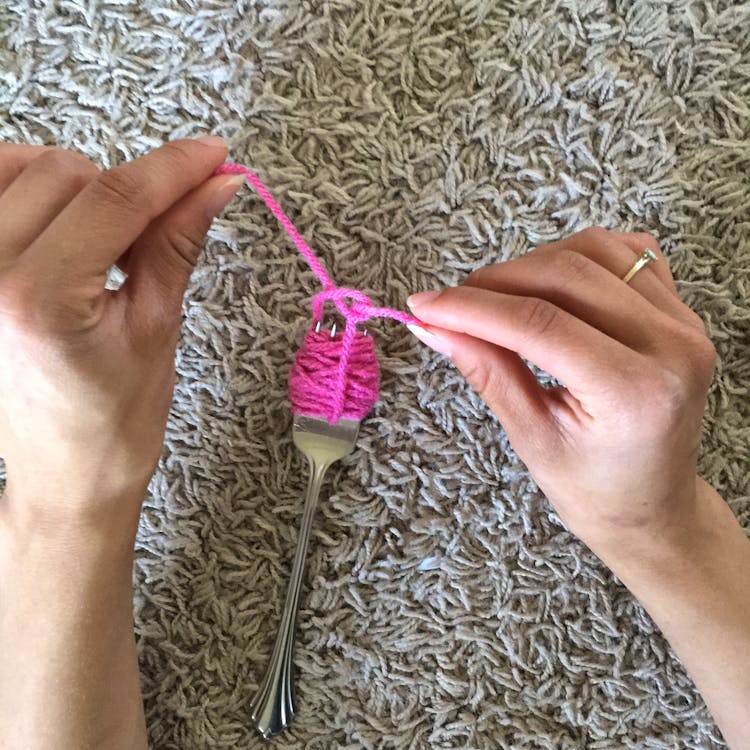 Fork with yarn wrapped around it Fork with yarn wrapped around it