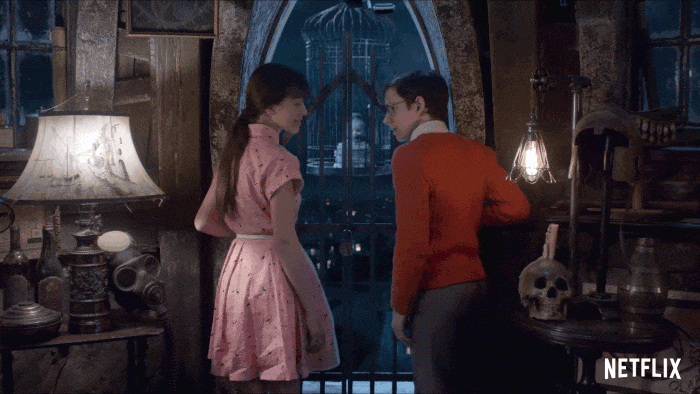 Dramatic zoom on boy and girl stood by the window Dramatic zoom on boy and girl stood by the window